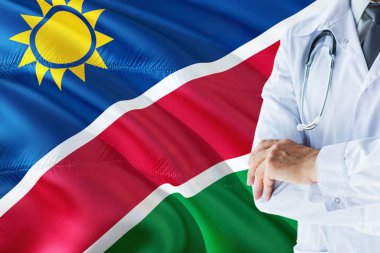 Namibya Doktor stetoskop Namibya bayrak arka plan üzerinde ayakta. Ulusal sağlık sisteminin kavramı, tıbbi Tema.