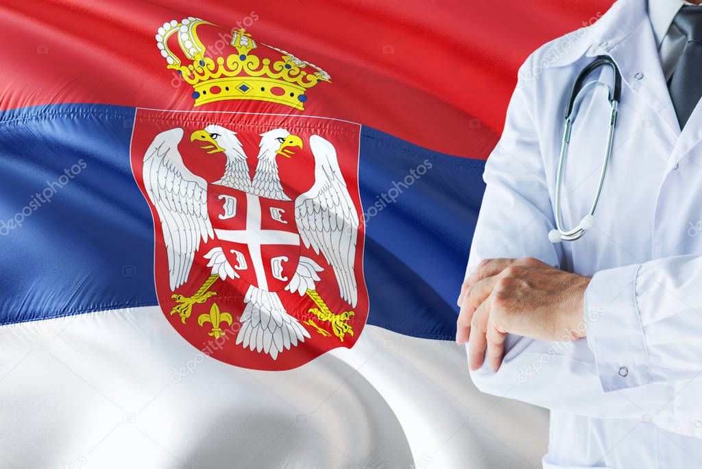 Serbian Doctor standing with stethoscope on Serbia flag background. National healthcare system concept, medical theme.