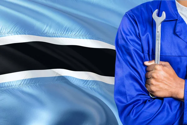 Kék Egyenruhában Szerelő Gazdaság Csavarkulcs Hullámzó Botswana Zászló Háttérrel Karokkal — Stock Fotó