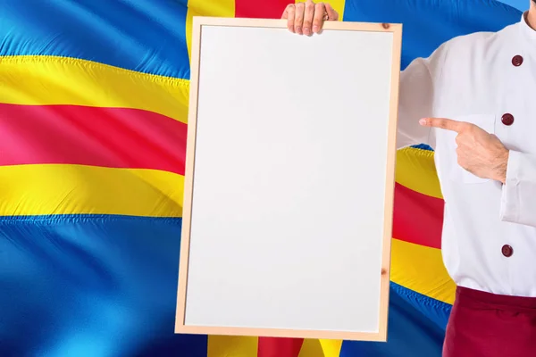 Chef Holding Blank Whiteboard Menu Aland Islands Flag Background Cook — Stock Photo, Image