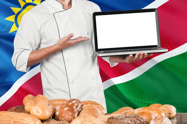 Намібійським Бейкер Проведення Ноутбук Фоні Прапора Хліб Намібії Шеф Кухар — стокове фото