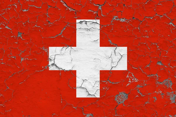 スイス連邦共和国の旗は ひびの入った汚い壁に描かれました ビンテージ スタイルのサーフェス上の国民パターン — ストック写真