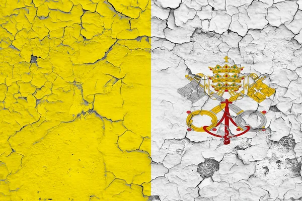 Flag of Vatican City painted on cracked dirty wall. National pattern on vintage style surface.
