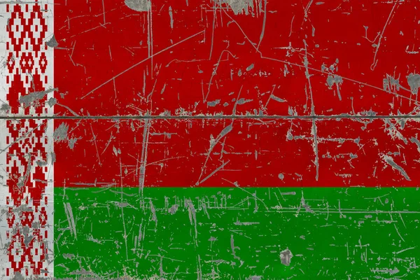 Grunge Belarus flag on old scratched wooden surface. National vintage background.