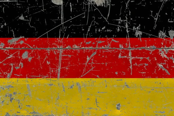 Grunge Germany flag on old scratched wooden surface. National vintage background.