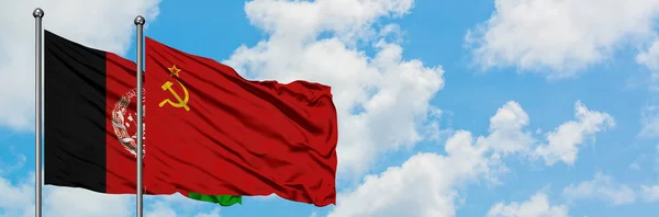 Afghanistan and Soviet Union flag waving in the wind against white cloudy blue sky together. Diplomacy concept, international relations. — Stock Photo, Image