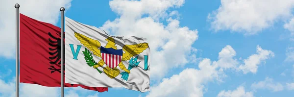 Albania and United States Virgin Islands flag waving in the wind against white cloudy blue sky together. Diplomacy concept, international relations. — Stock Photo, Image