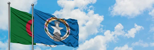 Algeria and Northern Mariana Islands flag waving in the wind against white cloudy blue sky together. Diplomacy concept, international relations. — Stock Photo, Image