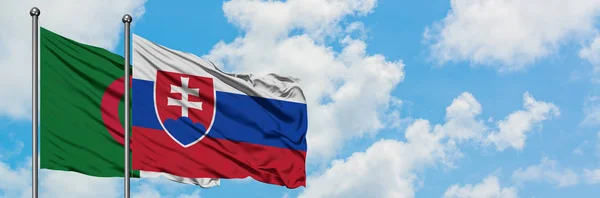Algeria and Slovakia flag waving in the wind against white cloudy blue sky together. Diplomacy concept, international relations. — Stock Photo, Image