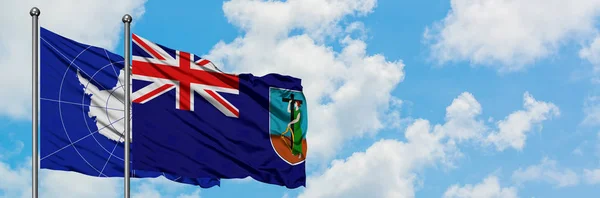 Antarctica en Montserrat vlag zwaaien in de wind tegen witte bewolkte blauwe hemel samen. Diplomatie concept, internationale betrekkingen. — Stockfoto
