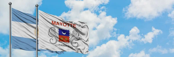 Argentina and Mayotte flag waving in the wind against white cloudy blue sky together. Diplomacy concept, international relations. — Stock Photo, Image