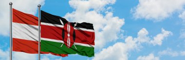 Avusturya ve Kenya bayrağı birlikte beyaz bulutlu mavi gökyüzüne karşı rüzgarda sallayarak. Diplomasi kavramı, uluslararası ilişkiler.