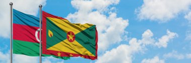 Azerbaycan ve Grenada bayrağı havada havada sallanıyor. Diplomasi kavramı, uluslararası ilişkiler.