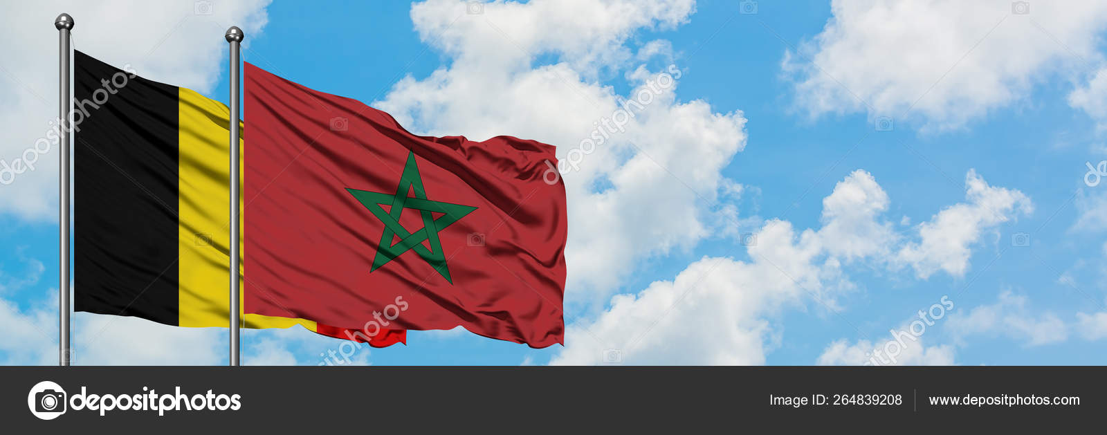 Drapeau de la Belgique et du Maroc agitant dans le vent contre ciel bleu  nuageux blanc ensemble. Concept de diplomatie, relations internationales .  image libre de droit par sezerozger © #264839208
