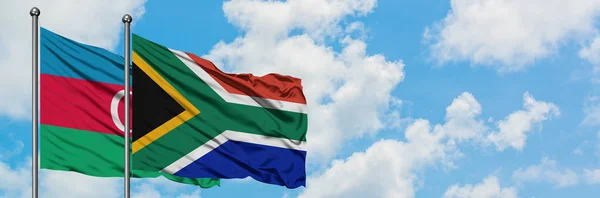 Azerbaijan and South Africa flag waving in the wind against white cloudy blue sky together. Diplomacy concept, international relations. — Stock Photo, Image