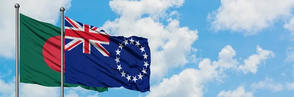 Bangladesh and Cook Islands flag waving in the wind against white cloudy blue sky together. Diplomacy concept, international relations. — Stock Photo, Image