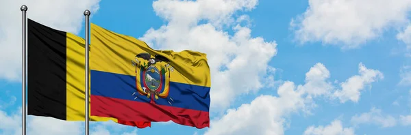 Belgium and Ecuador flag waving in the wind against white cloudy blue sky together. Diplomacy concept, international relations. — Stock Photo, Image