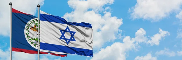 Беліз і Ізраїль прапор розмахуючи в вітру проти білого хмарного синього неба разом. Концепція дипломатії, міжнародні відносини. — стокове фото