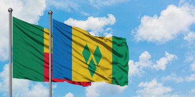 Benin ve Saint Vincent ve Grenadinler bayrak birlikte beyaz bulutlu mavi gökyüzüne karşı rüzgarda sallayarak. Diplomasi kavramı, uluslararası ilişkiler.