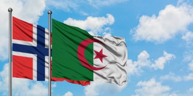 Bouvet Adaları ve Cezayir bayrağı birlikte beyaz bulutlu mavi gökyüzüne karşı rüzgarda sallayarak. Diplomasi kavramı, uluslararası ilişkiler.