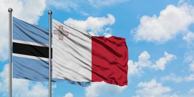 Botsvana ve Malta bayrağı birlikte beyaz bulutlu mavi gökyüzüne karşı rüzgarda sallayarak. Diplomasi kavramı, uluslararası ilişkiler.