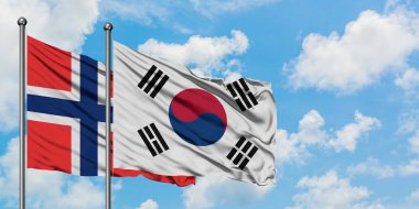 Bouvet Adaları ve Güney Kore bayrağı birlikte beyaz bulutlu mavi gökyüzüne karşı rüzgarda sallayarak. Diplomasi kavramı, uluslararası ilişkiler.