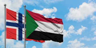 Bouvet Adaları ve Sudan bayrağı birlikte beyaz bulutlu mavi gökyüzüne karşı rüzgarda sallayarak. Diplomasi kavramı, uluslararası ilişkiler.