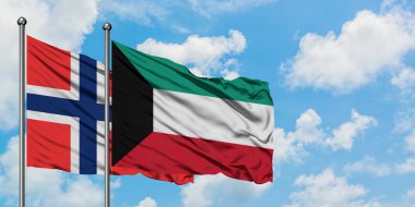 Bouvet Adaları ve Kuveyt bayrağı birlikte beyaz bulutlu mavi gökyüzüne karşı rüzgarsal sallayarak. Diplomasi kavramı, uluslararası ilişkiler.