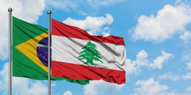 Brazil and Lebanon flag waving in the wind against white cloudy blue sky together. Diplomacy concept, international relations. clipart