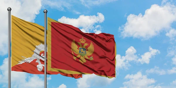 Bandiera del Bhutan e Montenegro sventola nel vento contro il bianco cielo blu nuvoloso insieme. Concetto di diplomazia, relazioni internazionali . — Foto Stock