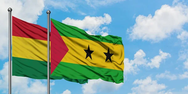 Bolivia and Sao Tome And Principe flag waving in the wind against white cloudy blue sky together. Diplomacy concept, international relations. — Stock Photo, Image