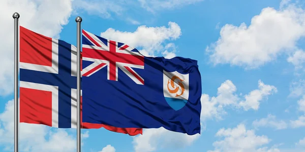 布韦特群岛和安圭拉国旗在风中飘扬，与白云蓝天相依为战。外交概念、国际关系. — 图库照片