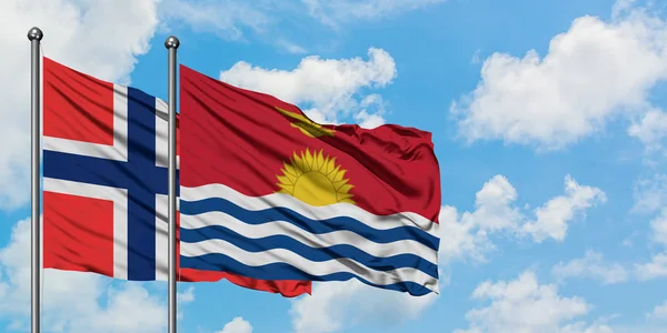 Islas Bouvet y la bandera de Kiribati ondeando en el viento contra el cielo azul nublado blanco juntos. Concepto diplomático, relaciones internacionales . — Foto de Stock