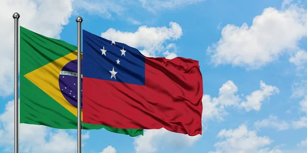 Brazil and Samoa flag waving in the wind against white cloudy blue sky together. Diplomacy concept, international relations. — Stock Photo, Image