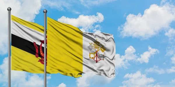 Brunei y la bandera de la Ciudad del Vaticano ondeando en el viento contra el blanco cielo azul nublado juntos. Concepto diplomático, relaciones internacionales . —  Fotos de Stock