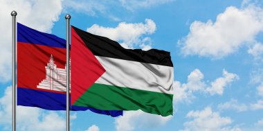 Kamboçya ve Filistin bayrağı birlikte beyaz bulutlu mavi gökyüzüne karşı rüzgarda sallayarak. Diplomasi kavramı, uluslararası ilişkiler.