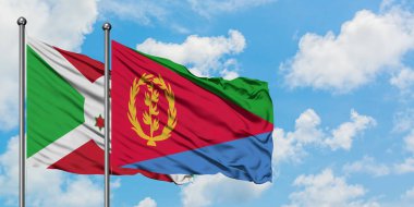 Burundi ve Eritre bayrağı birlikte beyaz bulutlu mavi gökyüzüne karşı rüzgarda sallayarak. Diplomasi kavramı, uluslararası ilişkiler.