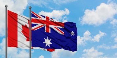 Kanada ve Heard Adası ve Mcdonald Adaları bayrağı birlikte beyaz bulutlu mavi gökyüzüne karşı rüzgarda sallayarak. Diplomasi kavramı, uluslararası ilişkiler.