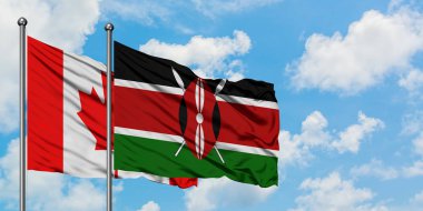 Kanada ve Kenya bayrağı birlikte beyaz bulutlu mavi gökyüzüne karşı rüzgarda sallayarak. Diplomasi kavramı, uluslararası ilişkiler.