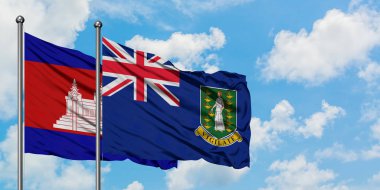 Kamboçya ve İngiliz Virgin Adaları bayrağı birlikte beyaz bulutlu mavi gökyüzüne karşı rüzgarda sallayarak. Diplomasi kavramı, uluslararası ilişkiler.