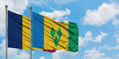 Çad ve Saint Vincent ve Grenadinler bayrağı birlikte beyaz bulutlu mavi gökyüzüne karşı rüzgarda sallayarak. Diplomasi kavramı, uluslararası ilişkiler.