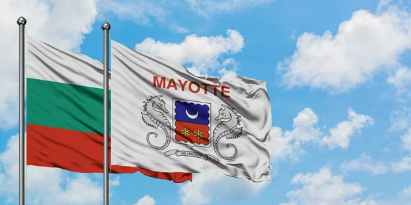 Bulgaria and Mayotte flag waving in the wind against white cloudy blue sky together. Diplomacy concept, international relations. — Stock Photo, Image