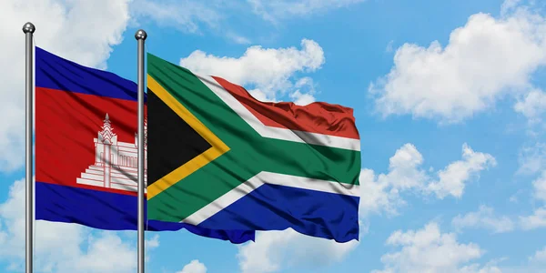 Cambodia and South Africa flag waving in the wind against white cloudy blue sky together. Diplomacy concept, international relations. — Stock Photo, Image