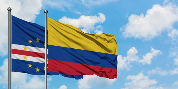 Cape Verde and Colombia flag waving in the wind against white cloudy blue sky together. Diplomacy concept, international relations. — Stock Photo, Image