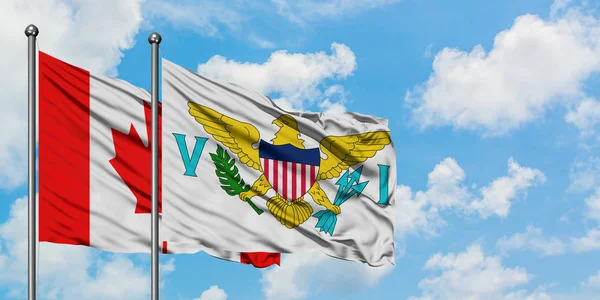 Bandera de Canadá y las Islas Vírgenes de los Estados Unidos ondeando en el viento contra el cielo azul nublado blanco juntos. Concepto diplomático, relaciones internacionales . — Foto de Stock