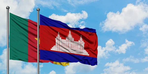 Cameroon and Cambodia flag waving in the wind against white cloudy blue sky together. Diplomacy concept, international relations. — Stock Photo, Image