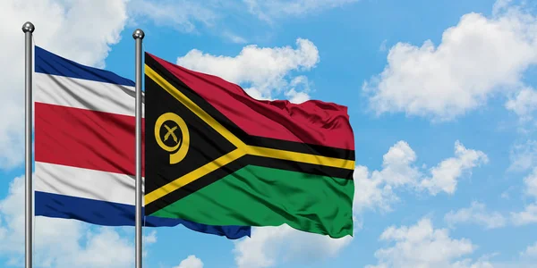 Costa Rica and Vanuatu flag waving in the wind against white cloudy blue sky together. Diplomacy concept, international relations. — Stock Photo, Image