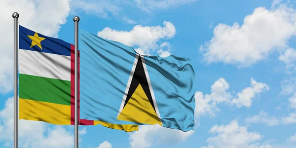 Central African Republic and Saint Lucia flag waving in the wind against white cloudy blue sky together. Diplomacy concept, international relations. — Stock Photo, Image