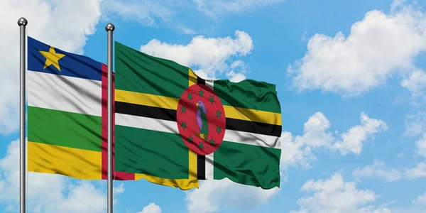 Central African Republic and Dominica flag waving in the wind against white cloudy blue sky together. Diplomacy concept, international relations. — Stock Photo, Image