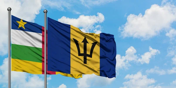 Central African Republic and Barbados flag waving in the wind against white cloudy blue sky together. Diplomacy concept, international relations. — Stock Photo, Image